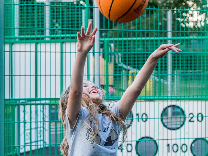 Young girl playing basketball 